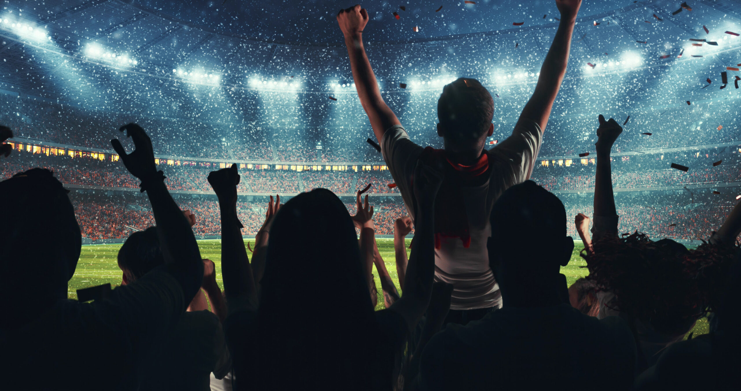 Fans celebrating the success of their favorite sports team on the stands of the professional stadium while it's snowing. Stadium is made in 3D.